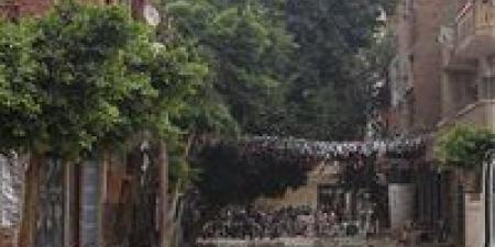 النيابة العامة تعاين موقع انهيار حائط من برج سكني بالمنيا وتصرح بدفن جثمان محفظة القرآن - أقرأ 24